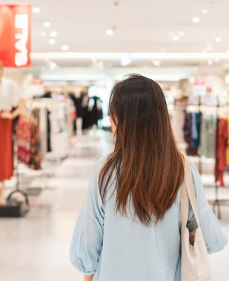 Young asian woman walking in clothes store at the mall, Woman lifestyle concept